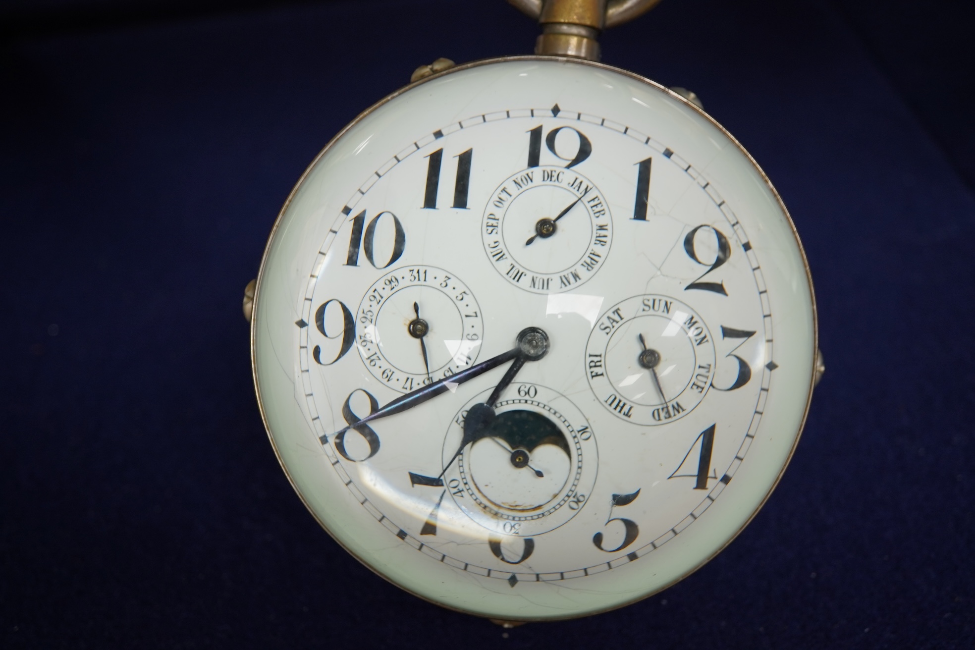 A large oversized spherical glass encased desk timepiece, with four subsidiary dials, 16cm